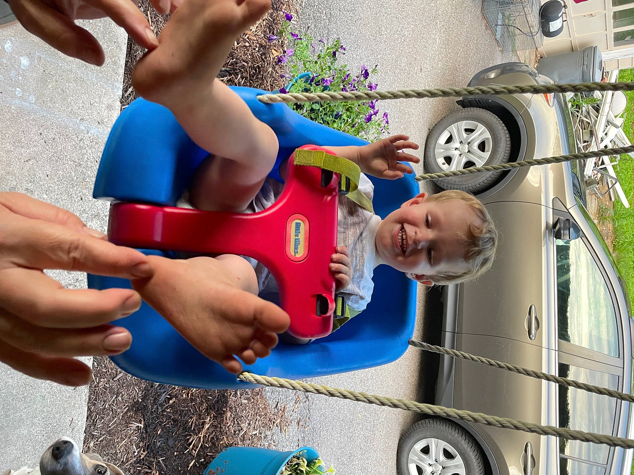 Kolt is registered to the contest to win money with this photo: automotive_exterior, automotive_wheel_system, blue, car, child, electric_blue, fun, hand, happy, joy, leisure, motor_vehicle, person, plant, recreation, shorts, thigh, tire, toddler, travel