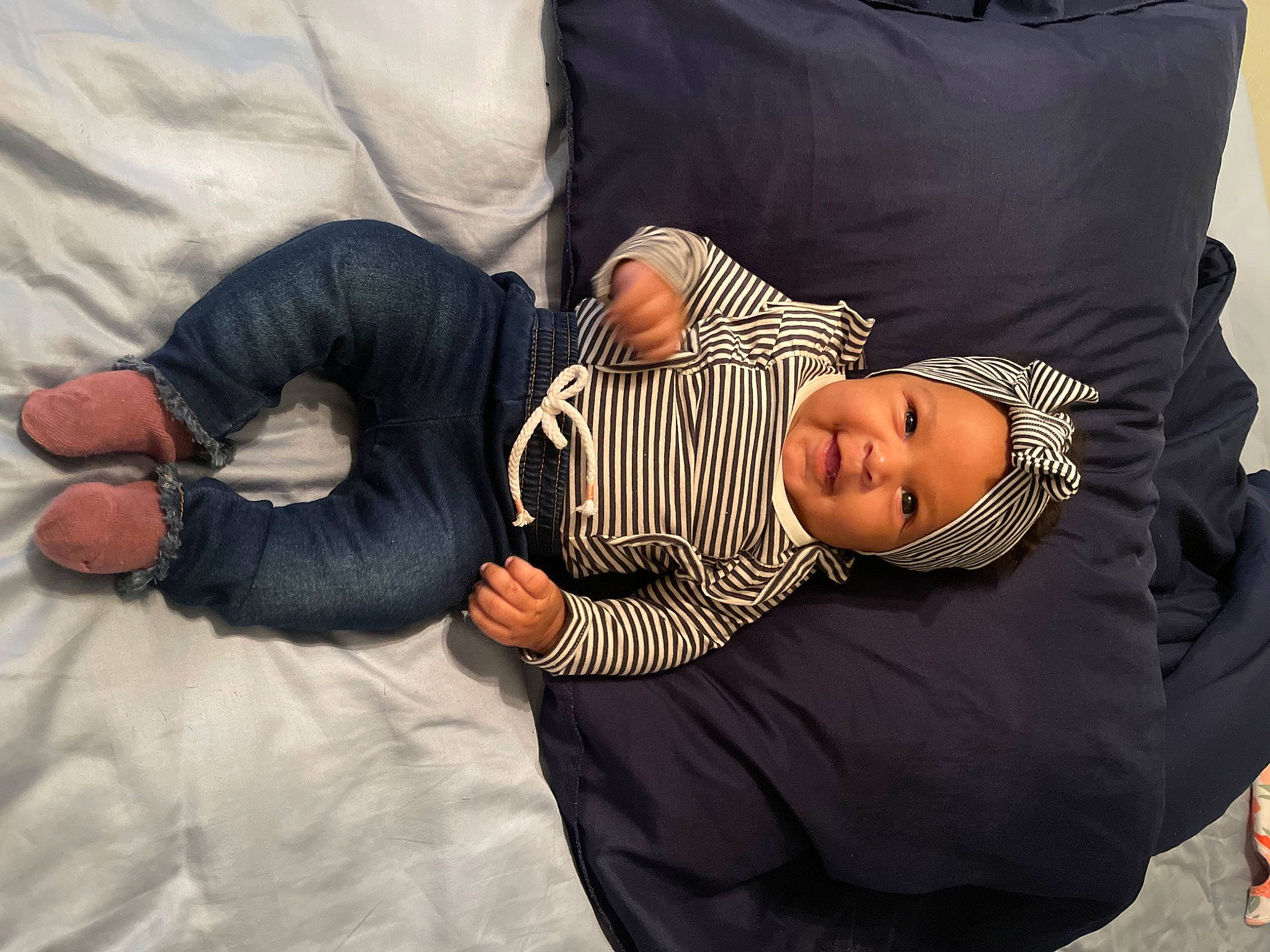 Journee joined the competition — help win amazing prizes! baby, baby_sleeping, baby_toddler_clothing, child, comfort, couch, finger, gesture, hat, headwear, human_leg, lap, linens, mammal, nap, person, room, sitting, sleeve, toddler