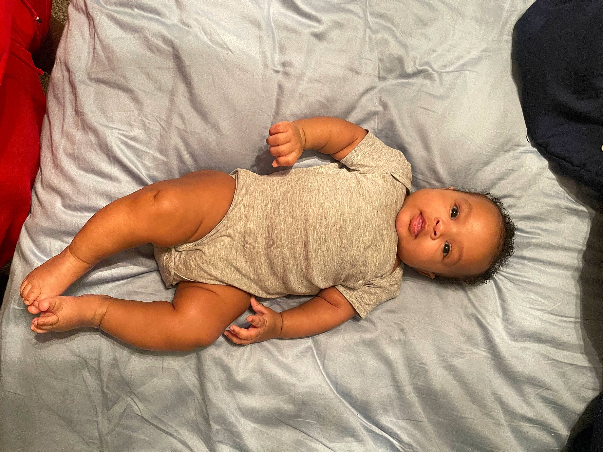 Journee is registered to the contest to win money with this photo: abdomen, arm, baby, beauty, bedding, child, comfort, elbow, finger, hand, human_body, linens, mammal, mouth, muscle, nose, person, skin, textile, toddler