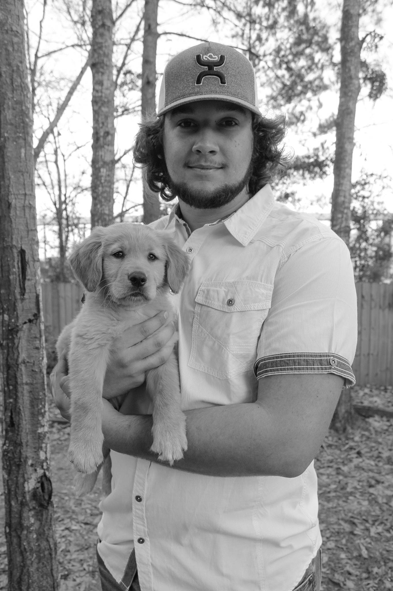 Tucker joined the competition — help win amazing prizes! baseball_cap, black_and_white, canidae, cap, carnivore, companion_dog, dog, dog_breed, fawn, gesture, happy, hat, mammal, monochrome, monochrome_photography, smile, sporting_group, style, tree, white