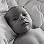 baby, black_and_white, blanket, child, close_up, cute, expression, eyes, face, head, human, infant, laying_down, monochrome, newborn, peaceful, portrait, skin, soft_texture, young_child