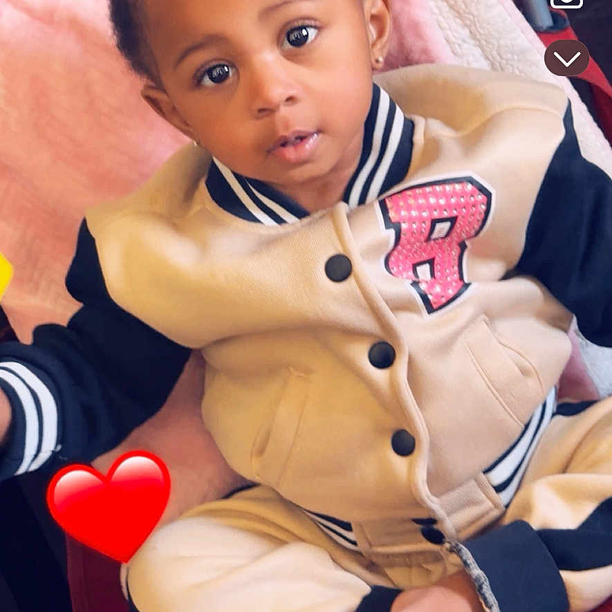 Jaylonnie joined the competition — help win amazing prizes! baby, baseball, baseballglove, bodypart, clothing, computerhardware, cushion, electronics, face, finger, glove, hand, hardware, head, homedecor, person, phone, photography, portrait, text