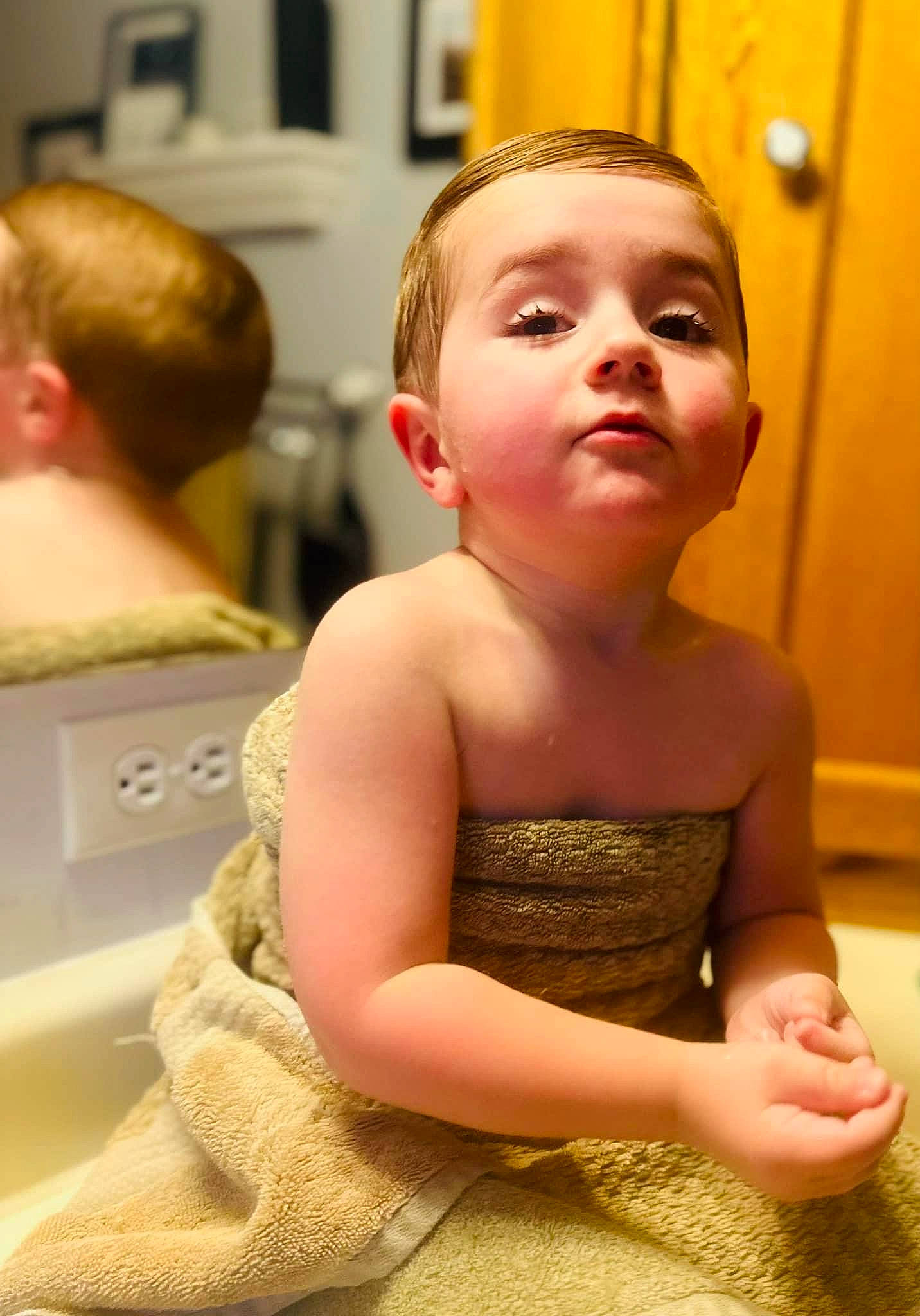 Chase is registered to the contest to win money with this photo: abdomen, baby_toddler_clothing, blond, cheek, child, chin, day_dress, dress, flooring, fun, happy, human_leg, person, room, shoulder, sitting, skin, standing, thigh, toddler