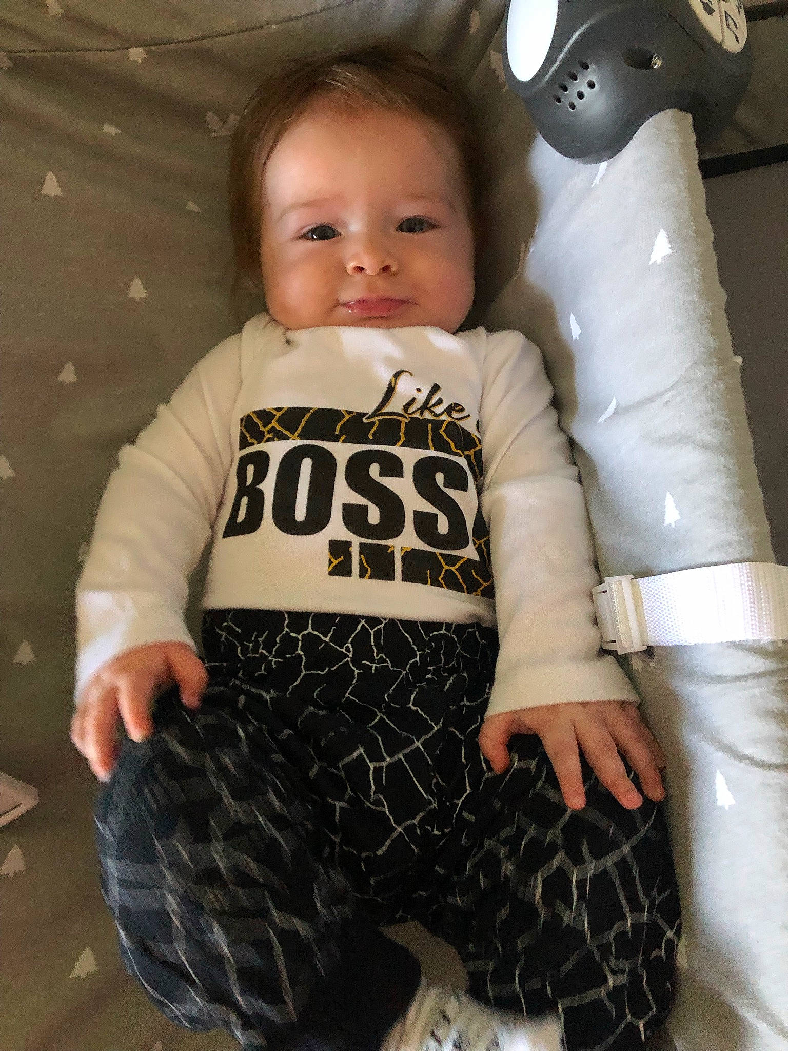 Conor is registered to the contest to win money with this photo: baby, baby_toddler_clothing, child, eye, face, flash_photography, head, human_body, joint, knee, neck, outerwear, person, personal_protective_equipment, shoulder, skin, sleeve, sportswear, standing, thigh