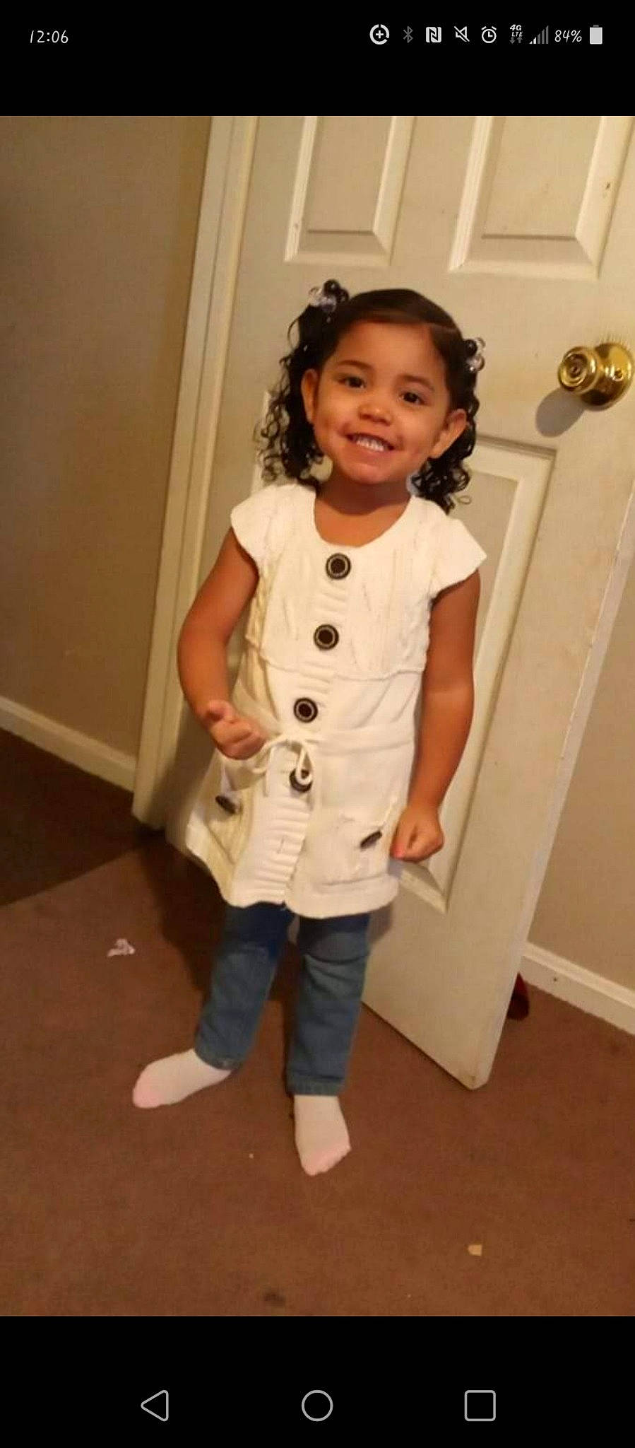 Amina is registered to the contest to win money with this photo: baby_toddler_clothing, child, collar, costume, door, dress_shirt, embellishment, fashion_design, happy, joy, knee, neck, pattern, person, room, shoulder, sleeve, smile, t_shirt, thumb