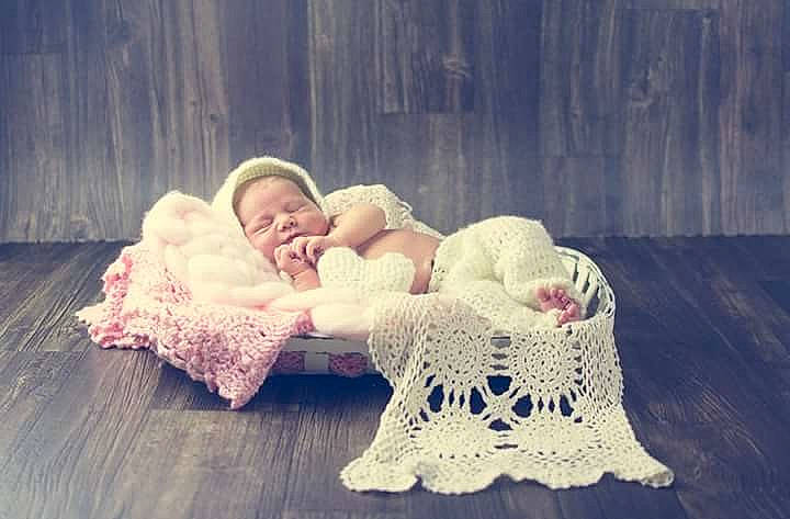 Jamie is registered to the contest to win money with this photo: bed, child, crochet, flooring, girl, infant, knitting, person, photograph, product, textile, toddler