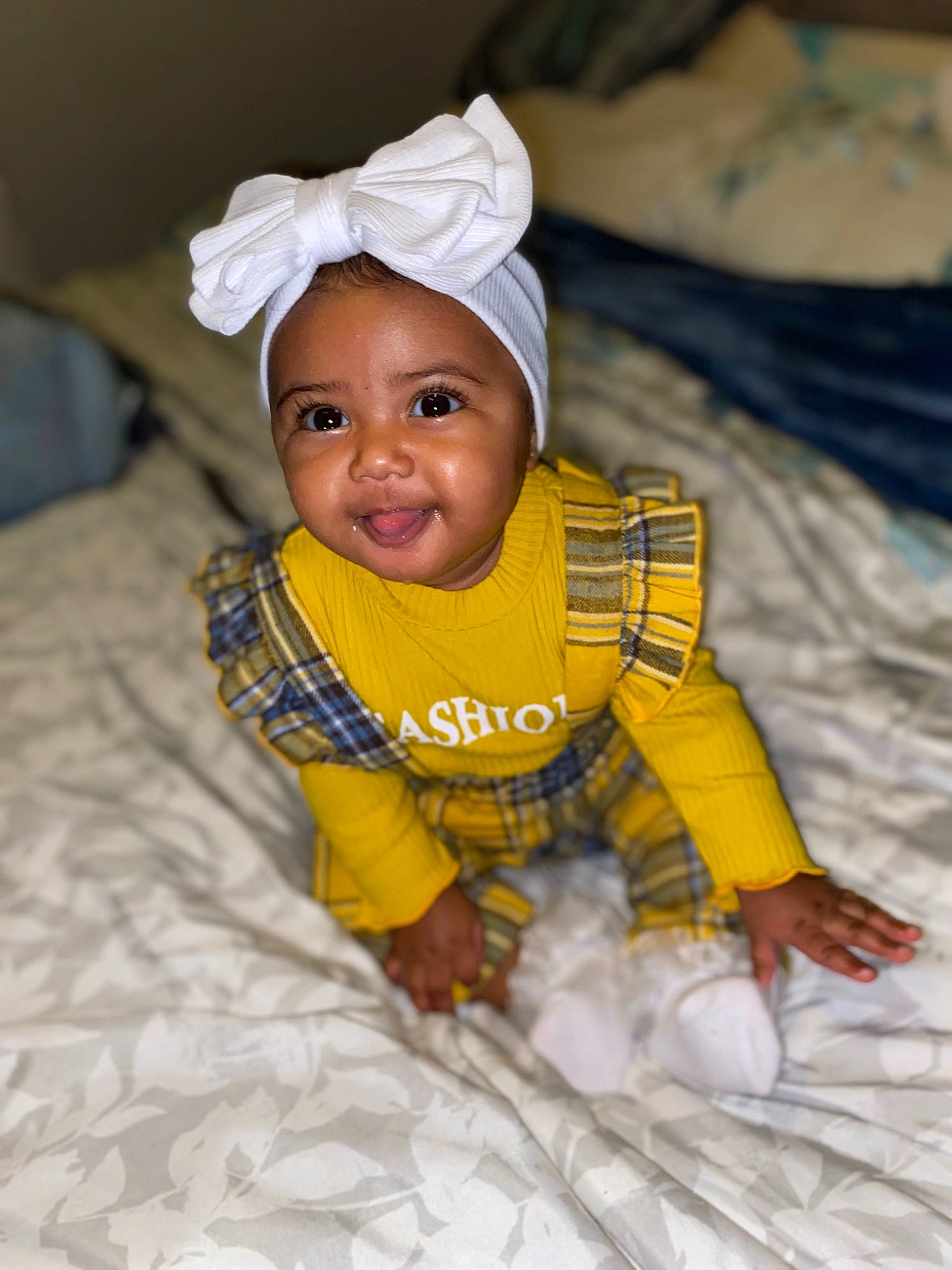 Naiomi joined the competition — help win amazing prizes! baby, baby_toddler_clothing, child, comfort, eye, flooring, fun, grass, happy, linens, person, product, room, sand, sitting, skin, sleeve, smile, t_shirt, toddler