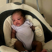 Kehlani joined the competition — help win amazing prizes! americanfootball, americanfootballball, baby, ball, bed, bodypart, crib, cushion, face, finger, football, furniture, hand, head, homedecor, newborn, person, photography, portrait, sport