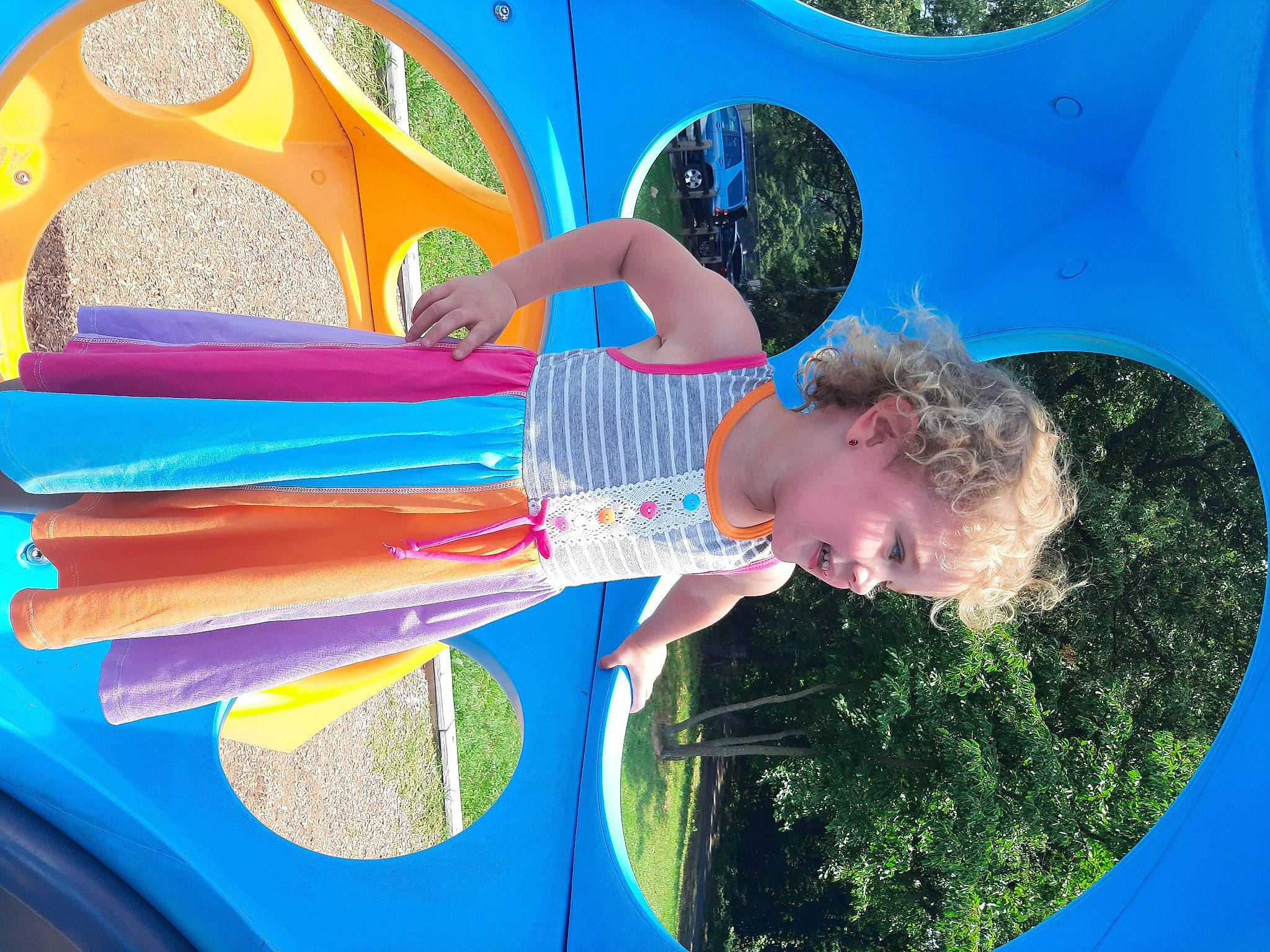 Lil is registered to the contest to win money with this photo: art, automotive_exterior, automotive_wheel_system, azure, blue, bumper, child, electric_blue, fun, green, happy, leisure, light, paint, people_in_nature, person, recreation, sky, summer, toddler