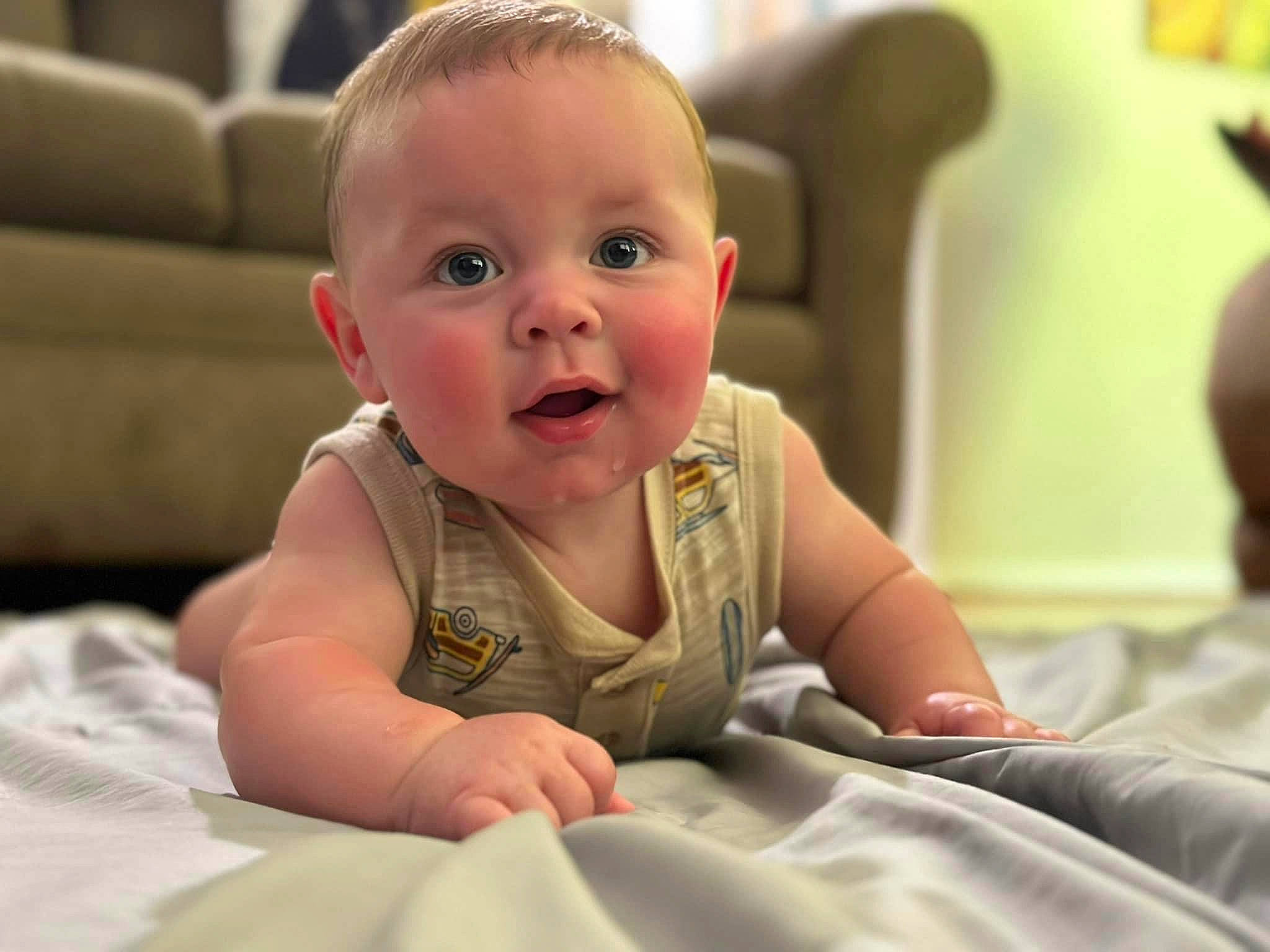 Kylan joined the competition — help win amazing prizes! baby, baby_toddler_clothing, cheek, child, comfort, crawling, eyebrow, flooring, fun, happy, iris, mammal, mouth, nose, person, room, sitting, skin, smile, toddler