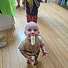 Kaleb joined the competition — help win amazing prizes! baby, child, toddler, infant, standing, eating, frozen_treat, popsicle, cup, drinking, smiling, indoors, wooden_floor, party, colorful_decoration, green_decoration, red_shorts, t_shirt, family, portrait