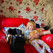 Felicity is registered to the contest to win money with this photo: accessories, architecture, bag, building, child, couch, cushion, face, female, furniture, girl, handbag, head, homedecor, indoors, livingroom, person, photography, portrait, room