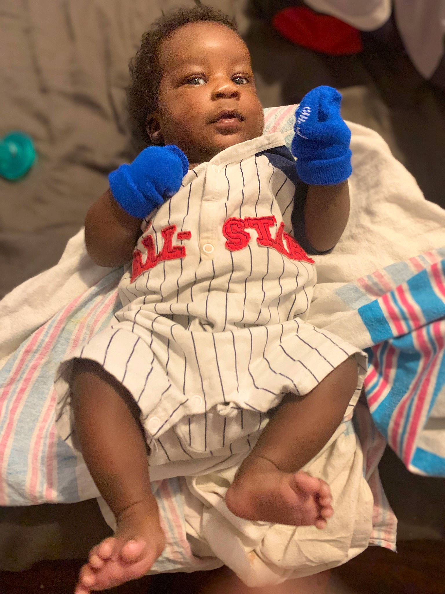 Kaiden is registered to the contest to win money with this photo: baby, barefoot, blue, comfort, elbow, foot, fun, gesture, happy, human_body, human_leg, joint, knee, leisure, nail, person, skin, textile, thigh, thumb