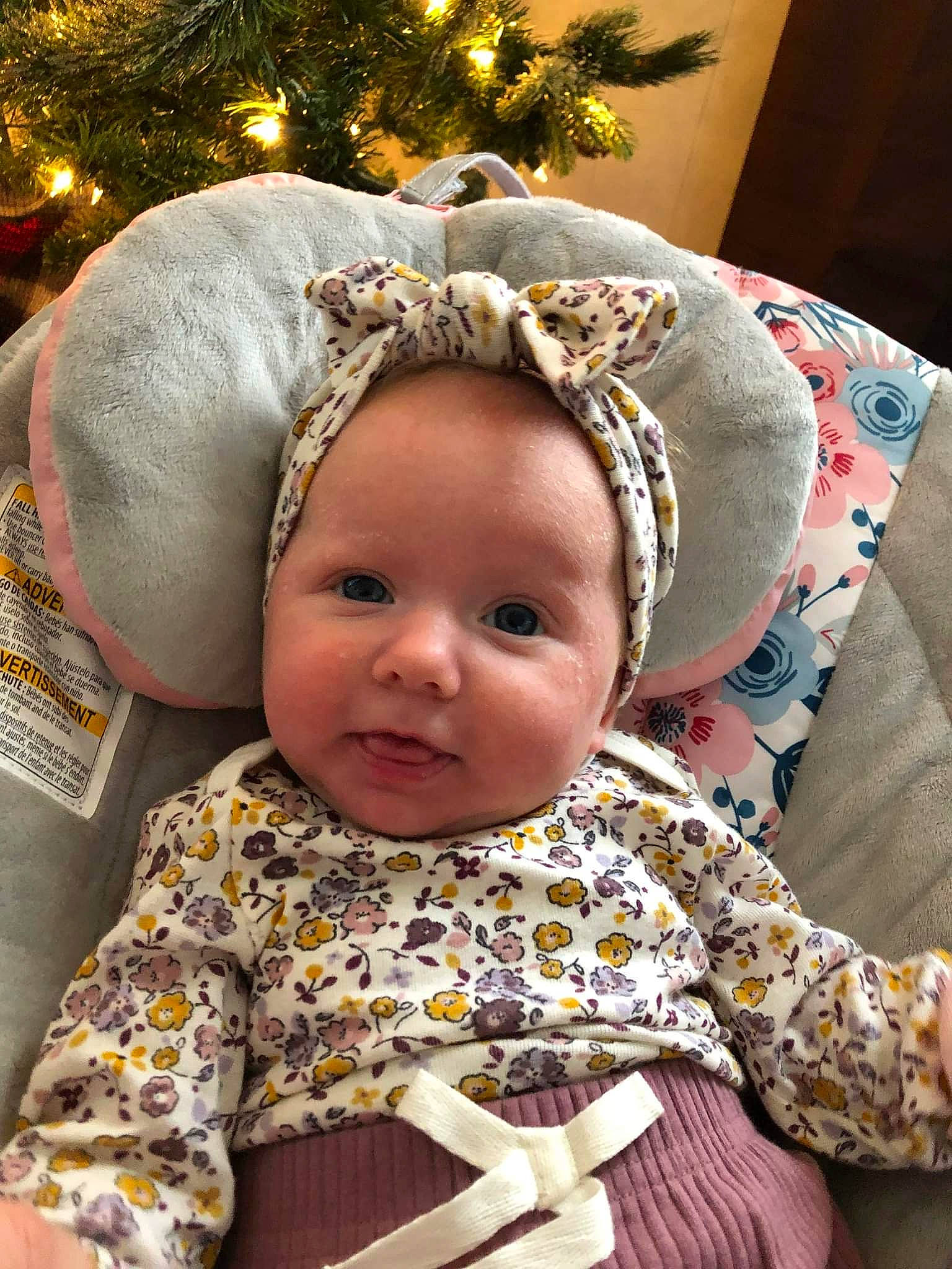 Brylee is registered to the contest to win money with this photo: baby, baby_toddler_clothing, child, christmas_ornament, christmas_tree, costume_hat, event, eye, face, facial_expression, fashion_accessory, fun, happy, head, holiday, linens, ornament, person, toddler, tradition