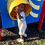 Vincent is registered to the contest to win money with this photo: toddler, child, playground, yellow_tunnel, smiling, outdoor, grass, sunlight, shoes, shorts, white_socks, blue_panel, red_pole, happy, play, daylight, person, cute, reaching, fun