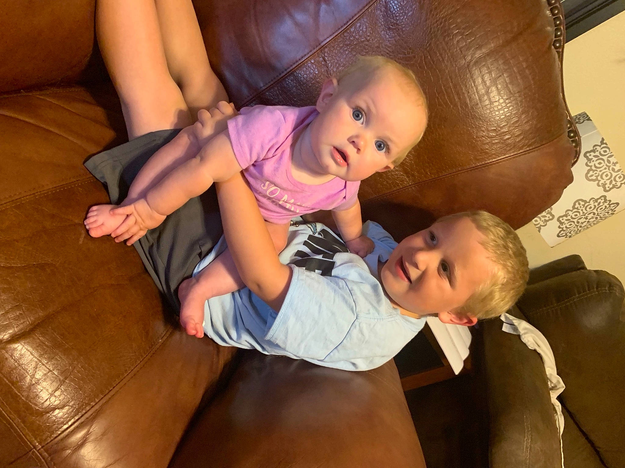 Jazmine is registered to the contest to win money with this photo: baby, chair, child, comfort, eye, face, facial_expression, finger, fun, happy, human_leg, interaction, iris, joy, lap, mouth, person, skin, smile, surprise