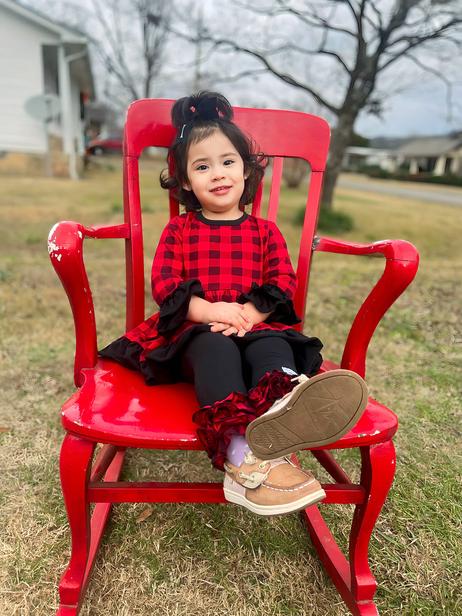 Izabella is registered to the contest to win money with this photo: chair, child, city, comfort, fun, furniture, grass, human_body, human_leg, joy, knee, leisure, magenta, person, plant, recreation, sitting, sky, smile, thigh