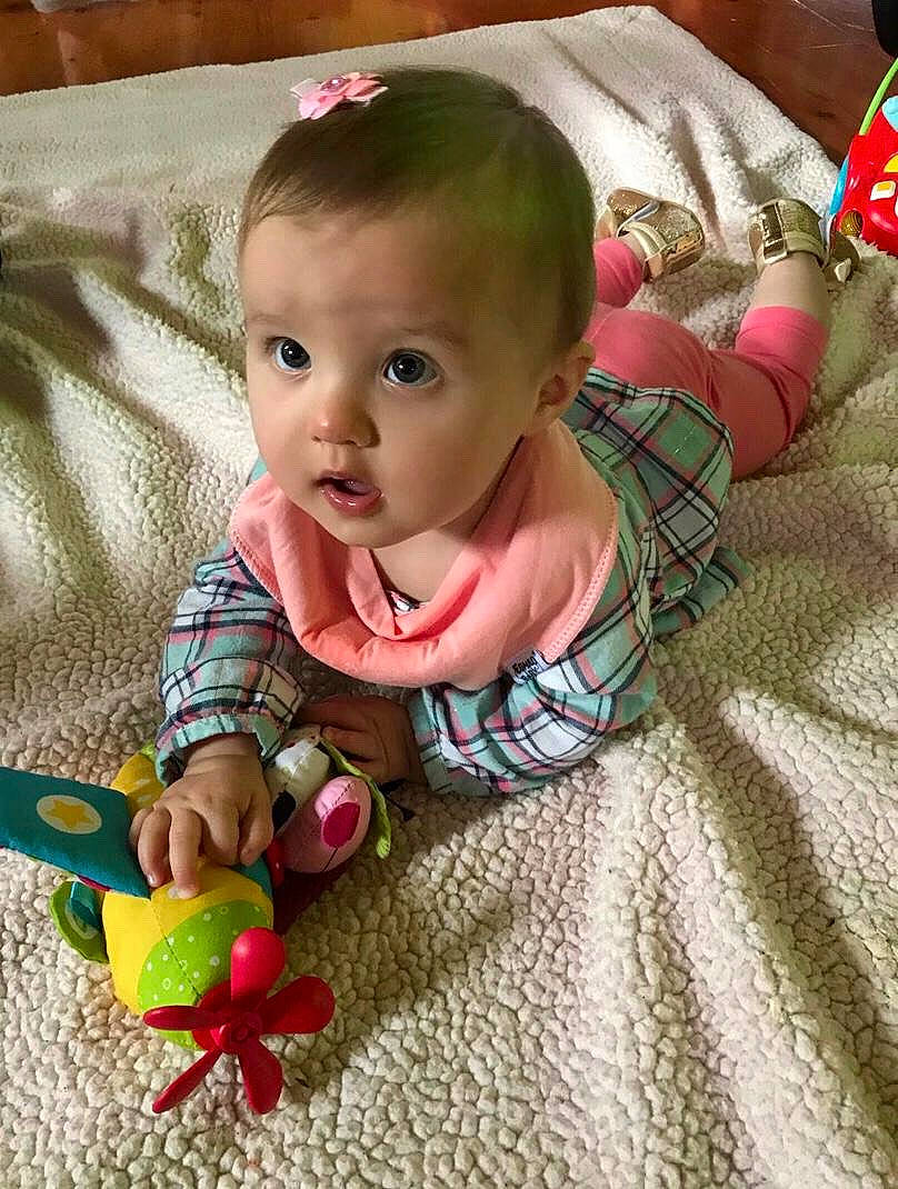 Siena joined the competition — help win amazing prizes! baby, baby_toddler_clothing, baby_toys, cheek, child, head, person, pink, play, sitting, skin, smile, textile, toddler, tummy_time
