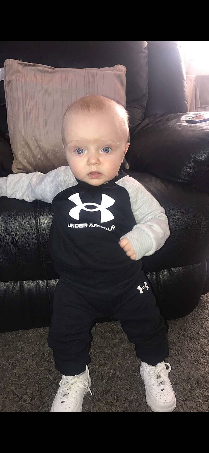 Arlo Jae joined the competition — help win amazing prizes! baby, baby_toddler_clothing, chair, child, comfort, cool, couch, flash_photography, flooring, fun, logo, monochrome, monochrome_photography, person, room, shoe, sitting, sleeve, sportswear, surprise