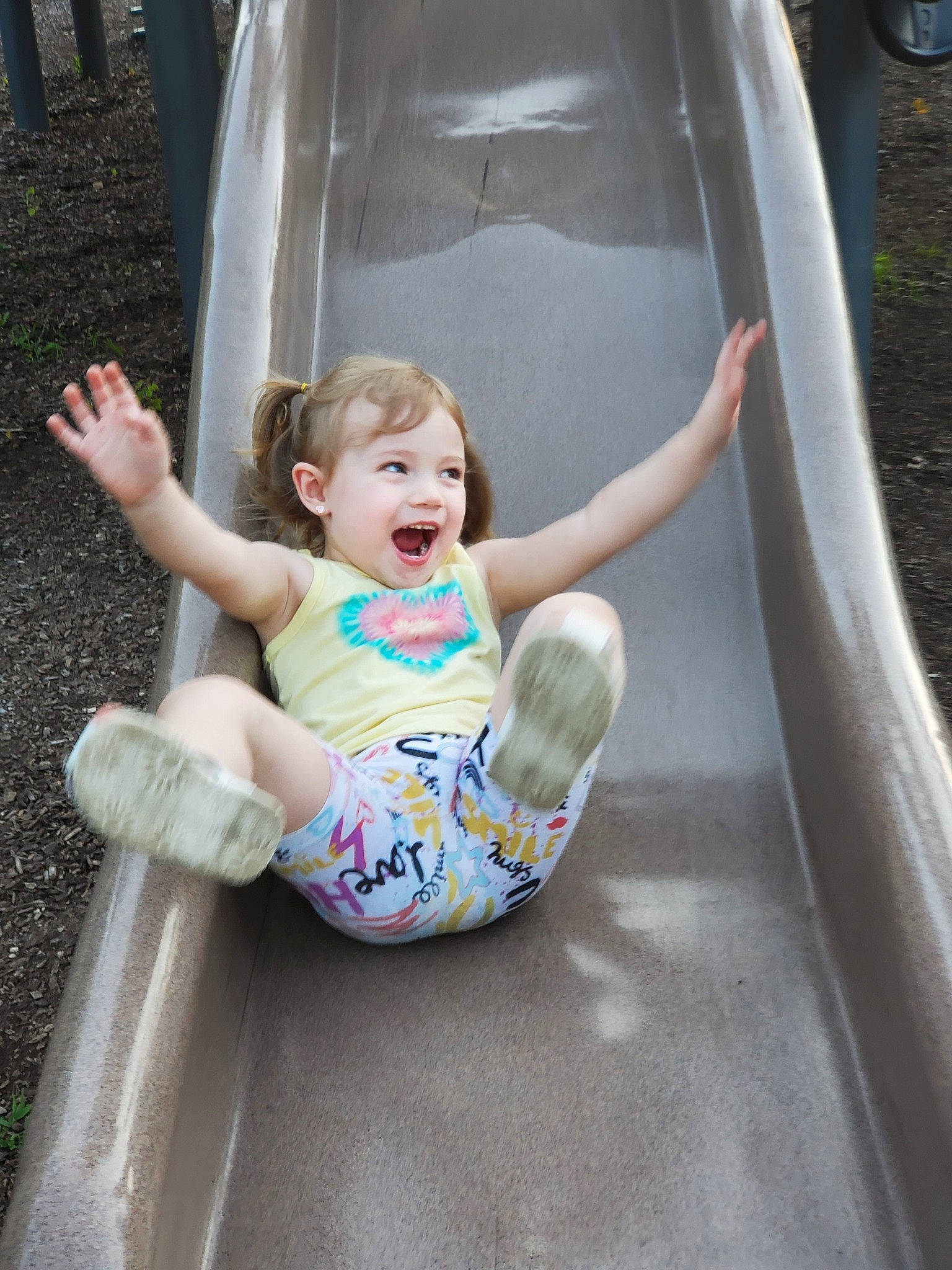 Emmalee joined the competition — help win amazing prizes! baby, baby_toddler_clothing, child, chute, city, comfort, fun, glass, grass, happy, leisure, outdoor_play_equipment, person, play, recreation, sandal, sitting, smile, tire, toddler