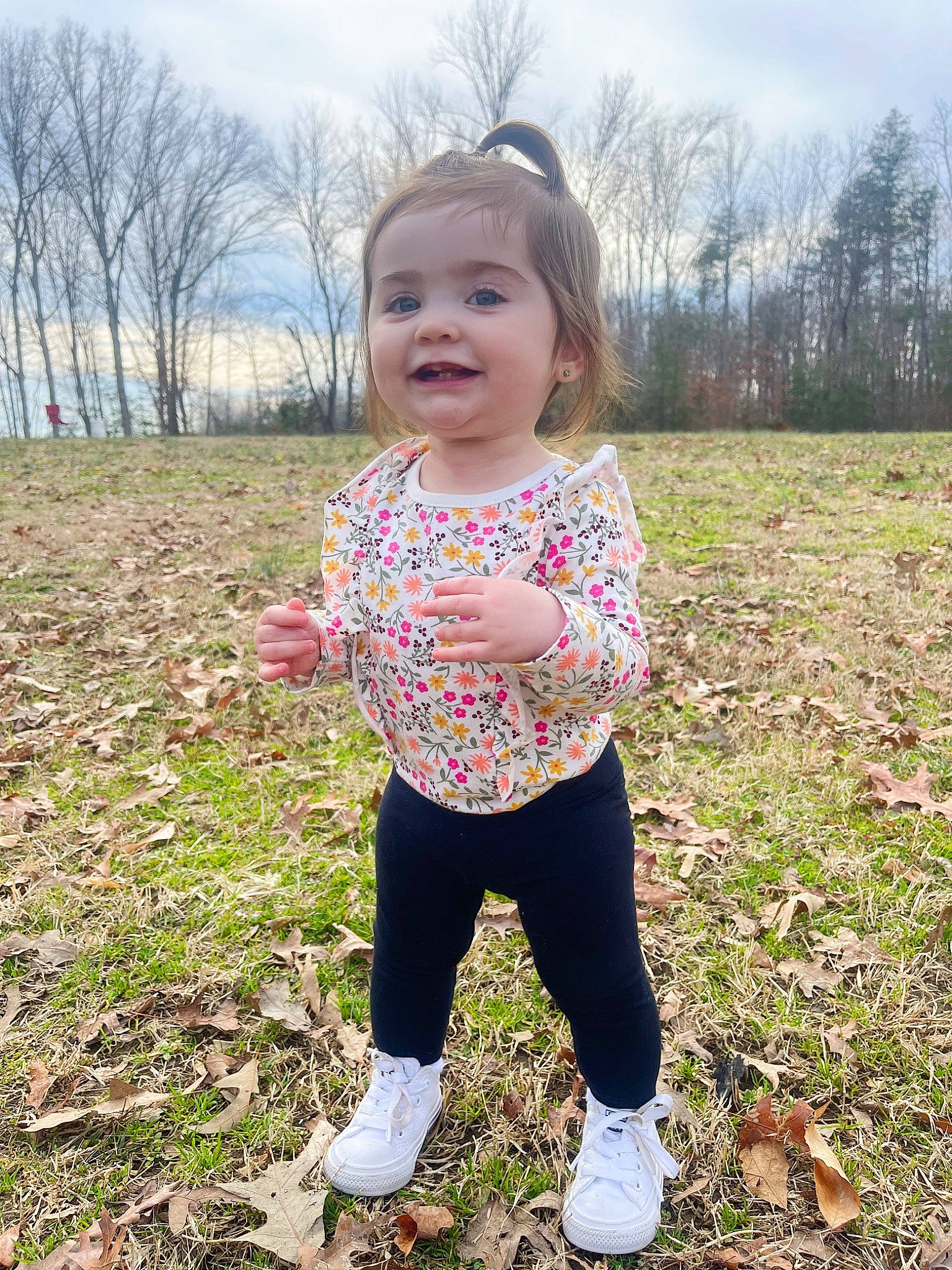 Kinsley is registered to the contest to win money with this photo: active_pants, baby_toddler_clothing, cloud, face, grass, grassland, happy, head, joy, pattern, people_in_nature, person, plant, recreation, sky, sleeve, smile, soil, spring, toddler