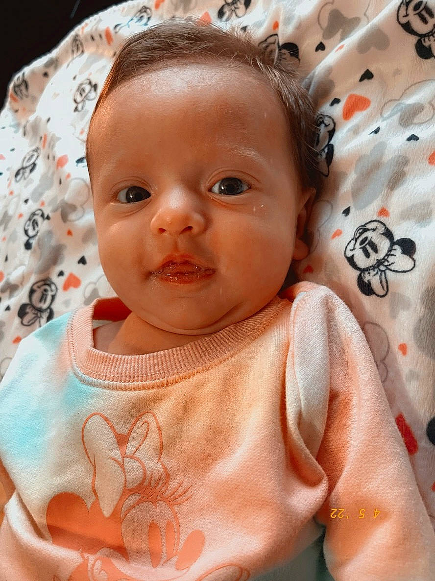 Amelia is registered to the contest to win money with this photo: baby, baby_toddler_clothing, cheek, chin, ear, eyebrow, eyelash, facial_expression, forehead, head, iris, lip, mouth, neck, nose, person, pink, skin, sleeve, textile