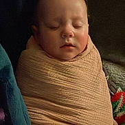 Eliza is registered to the contest to win money with this photo: baby, blanket, child, clothing, comfort, cozy, cute, face, indoor, infant, nap, peaceful, person, rest, skin, sleeping, soft_lighting, toddler, warm, wrapped