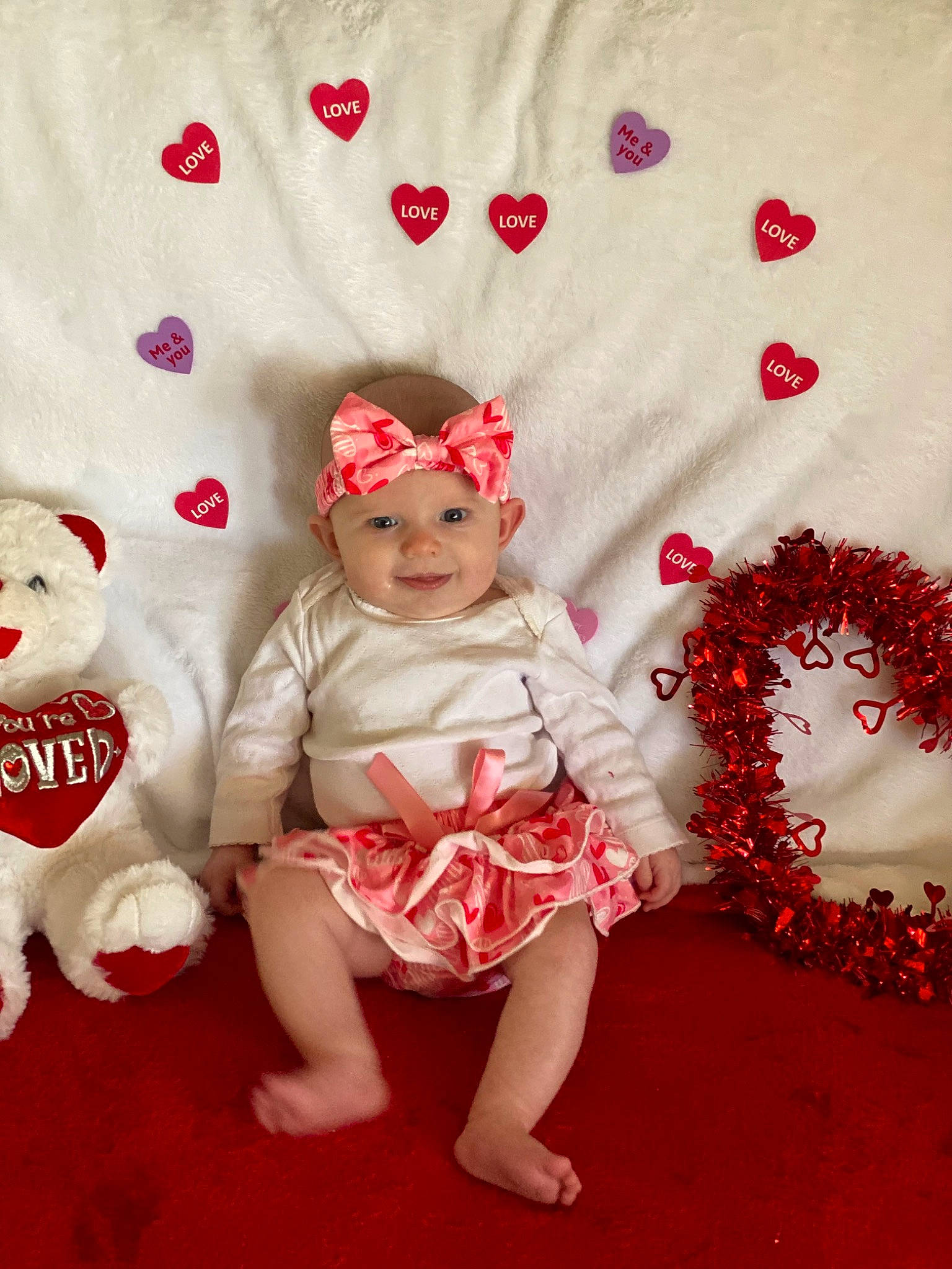 Briella joined the competition — help win amazing prizes! baby_toddler_clothing, carmine, child, costume_hat, dress, embellishment, event, fictional_character, flooring, happy, headpiece, headwear, joy, magenta, pattern, peach, person, petal, pink, sitting