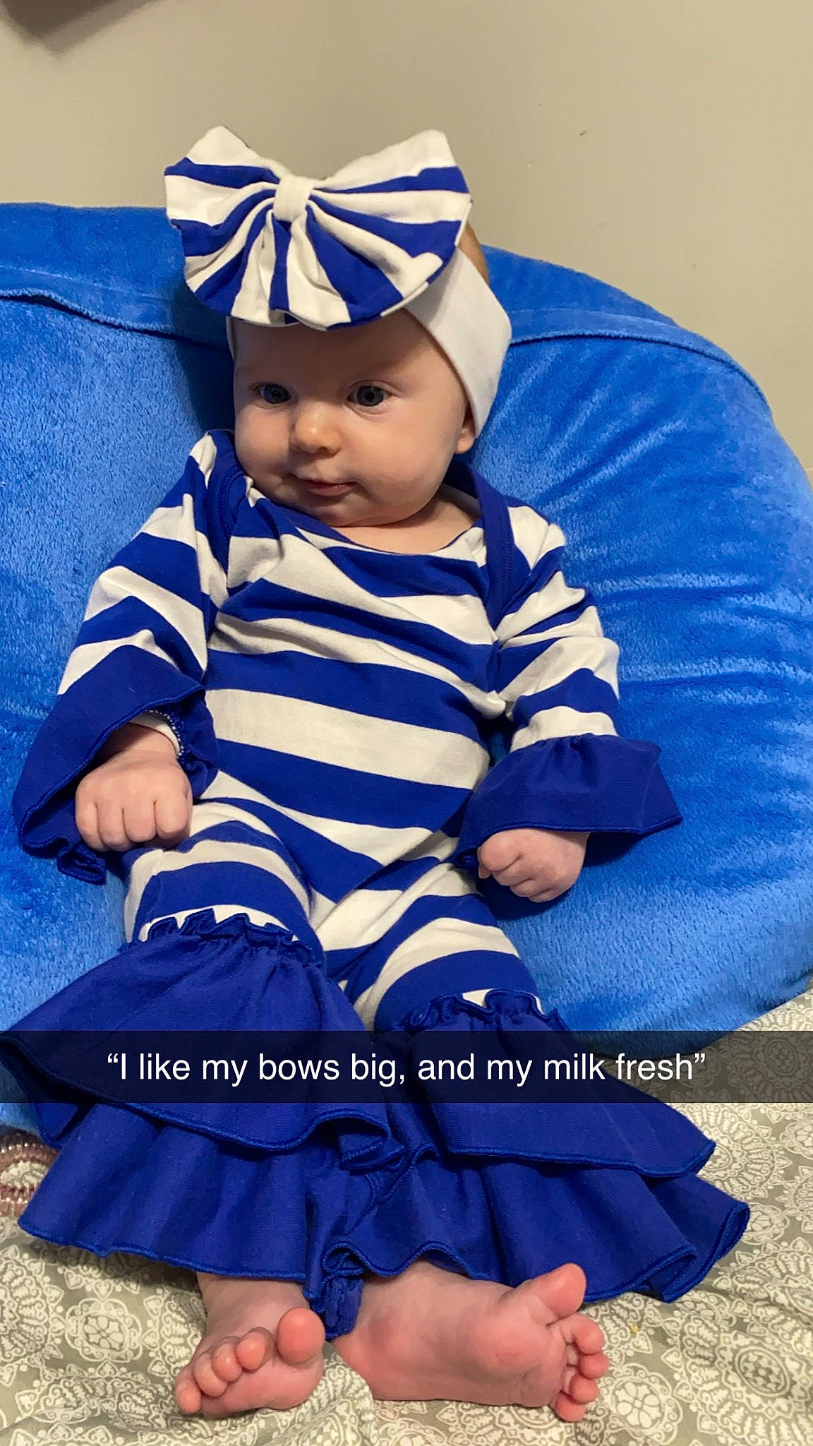 Briella is registered to the contest to win money with this photo: azure, baby, baby_products, baby_toddler_clothing, beanie, blue, cap, child, costume_hat, electric_blue, happy, hat, headwear, pattern, person, purple, shoe, sitting, sleeve, t_shirt