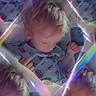 Waylon joined the competition — help win amazing prizes! toddler, child, patterned_clothing, lying_down, kaleidoscope_effect, rainbow_light, soft_light, pastel_colors, multiple_images, reflection, surreal, dreamy, portrait, indoor, blurry_faces, hands, baby, cute, soft_focus, artistic