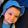 toddler, child, baby, blue_hat, blue_clothing, smile, face, eyes, cute, portrait, headwear, infant, closeup, young_child, person, seatbelt, indoor, skin, expression, baby_fashion