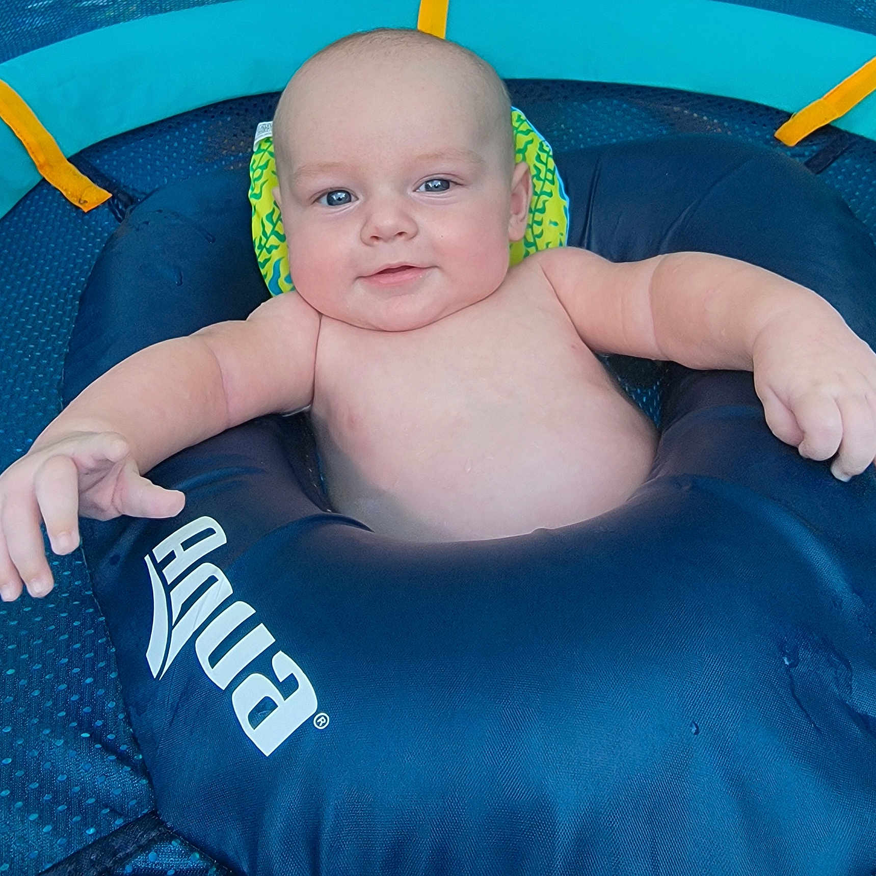 Keilan is registered to the contest to win money with this photo: baby, clothing, cushion, face, hat, head, homedecor, inflatable, lifejacket, newborn, person, photography, pool, portrait, summer, swimmingpool, swimwear, tubing, vest, water