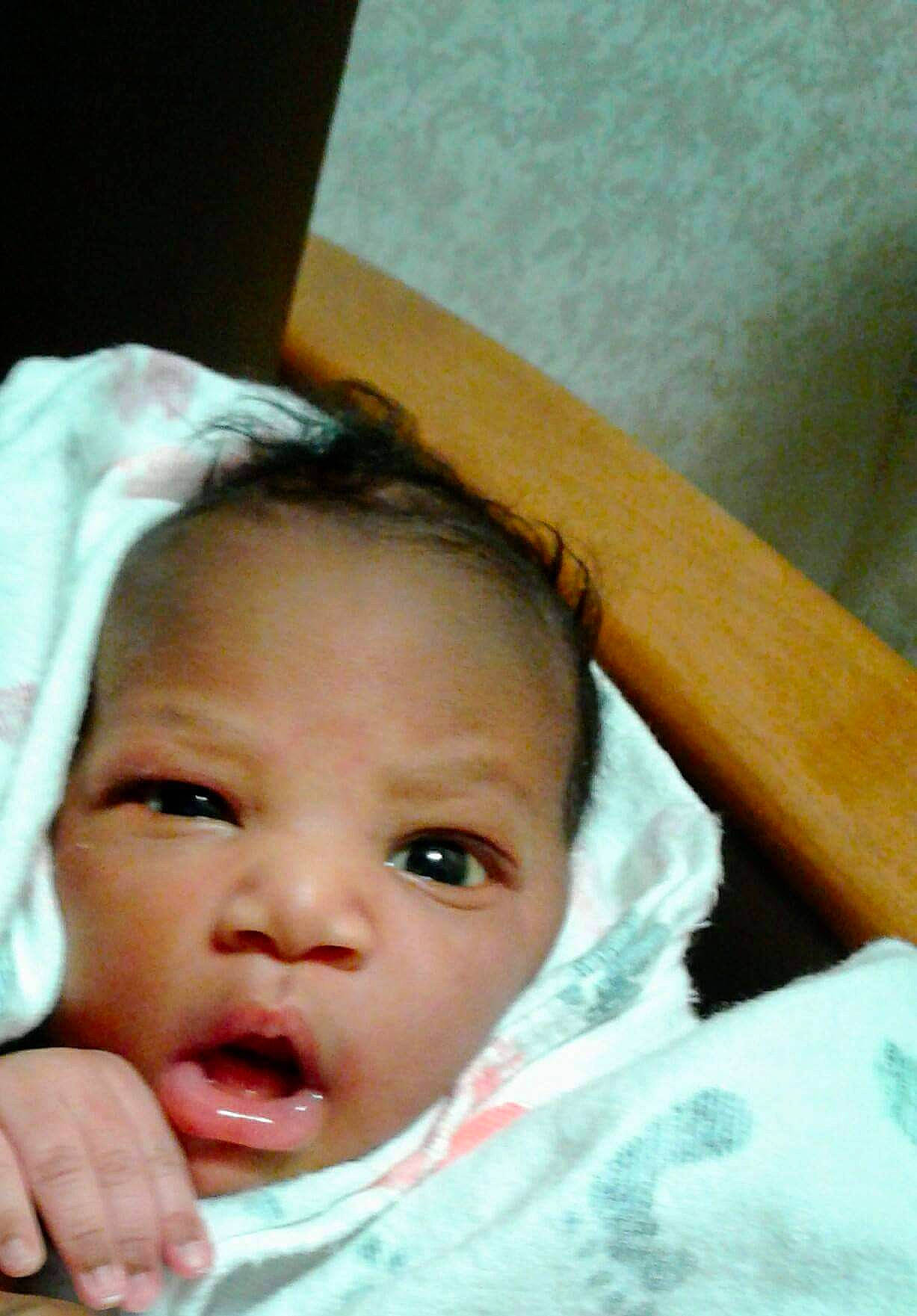 Maleah is registered to the contest to win money with this photo: baby, cheek, chin, ear, eye, eyebrow, eyelash, finger, forehead, gesture, hair, happy, iris, lip, mouth, nose, person, skin, sleeve, smile