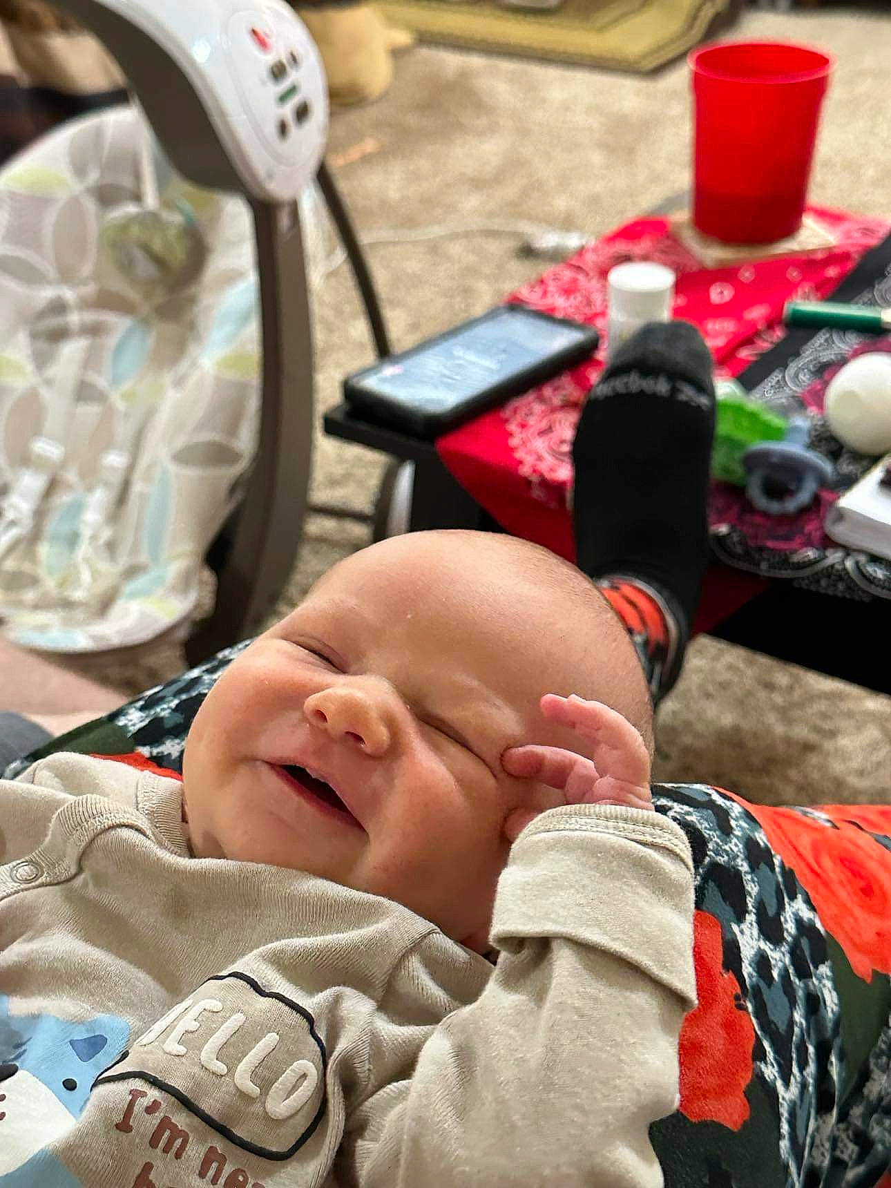 Braylen is registered to the contest to win money with this photo: baby, baby_products, baby_toddler_clothing, carmine, cheek, child, comfort, flooring, happy, pattern, person, product, sitting, skin, smile, tableware, toddler, water_bottle