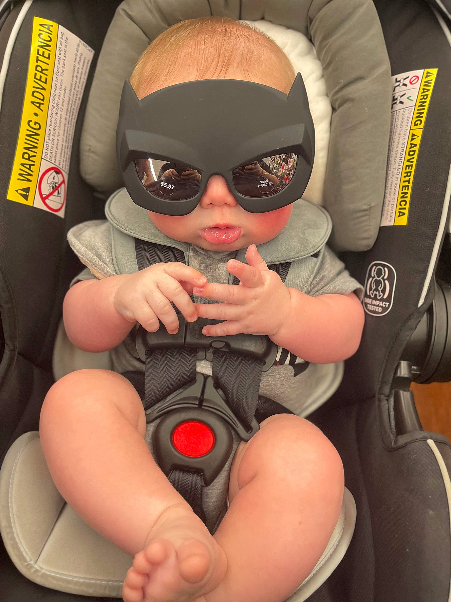 Killian is registered to the contest to win money with this photo: arm, auto_part, baby, baby_carriage, baby_products, car_seat, comfort, eyewear, finger, fun, goggles, person, personal_protective_equipment, recreation, service, sitting, sunglasses, thigh, thumb, toddler