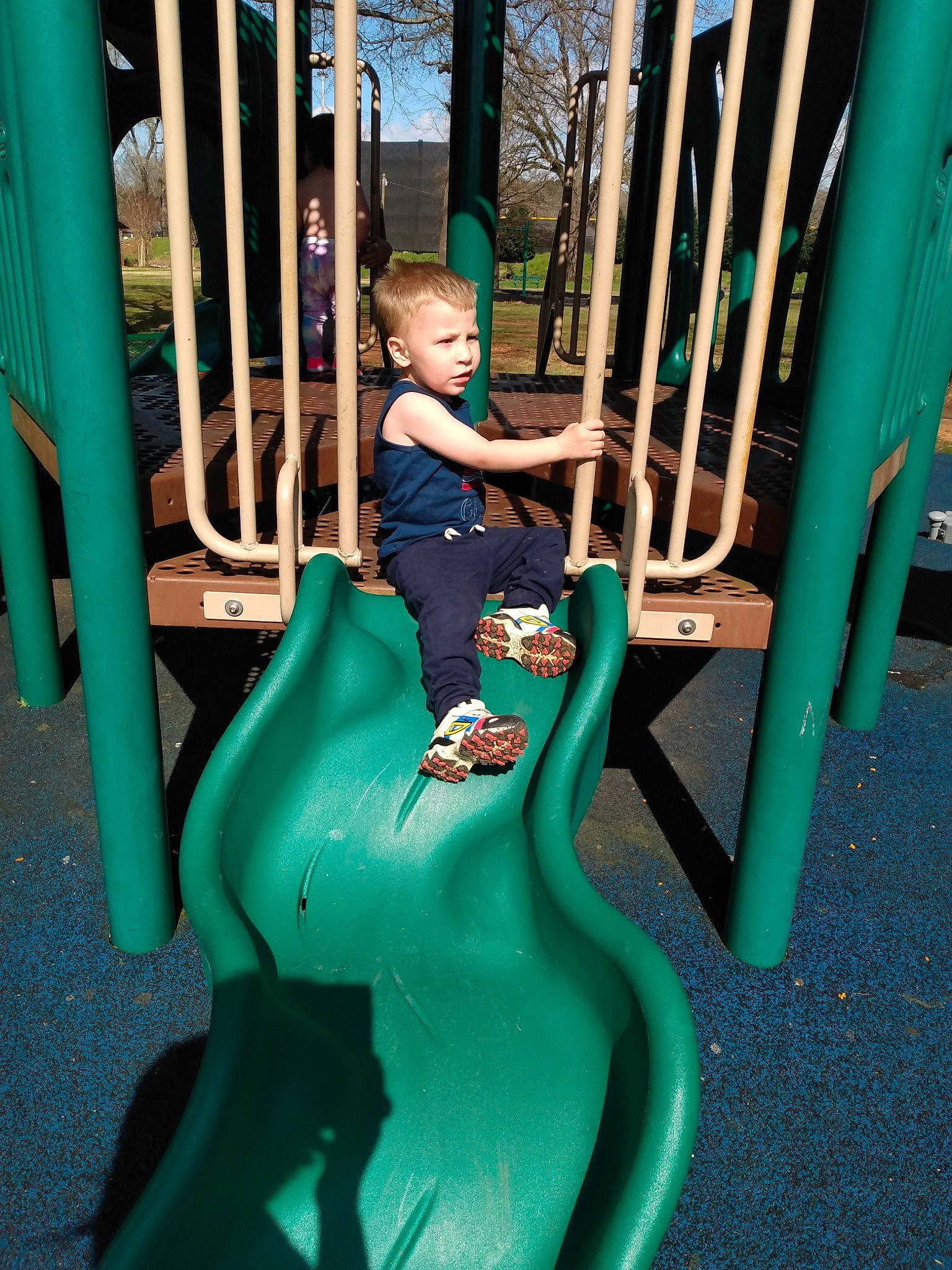Aden is registered to the contest to win money with this photo: aqua, baby_toddler_clothing, blue, child, chute, city, electric_blue, fun, green, leisure, outdoor_play_equipment, outdoor_recreation, person, play, playground, playground_slide, public_space, recreation, shorts, toddler