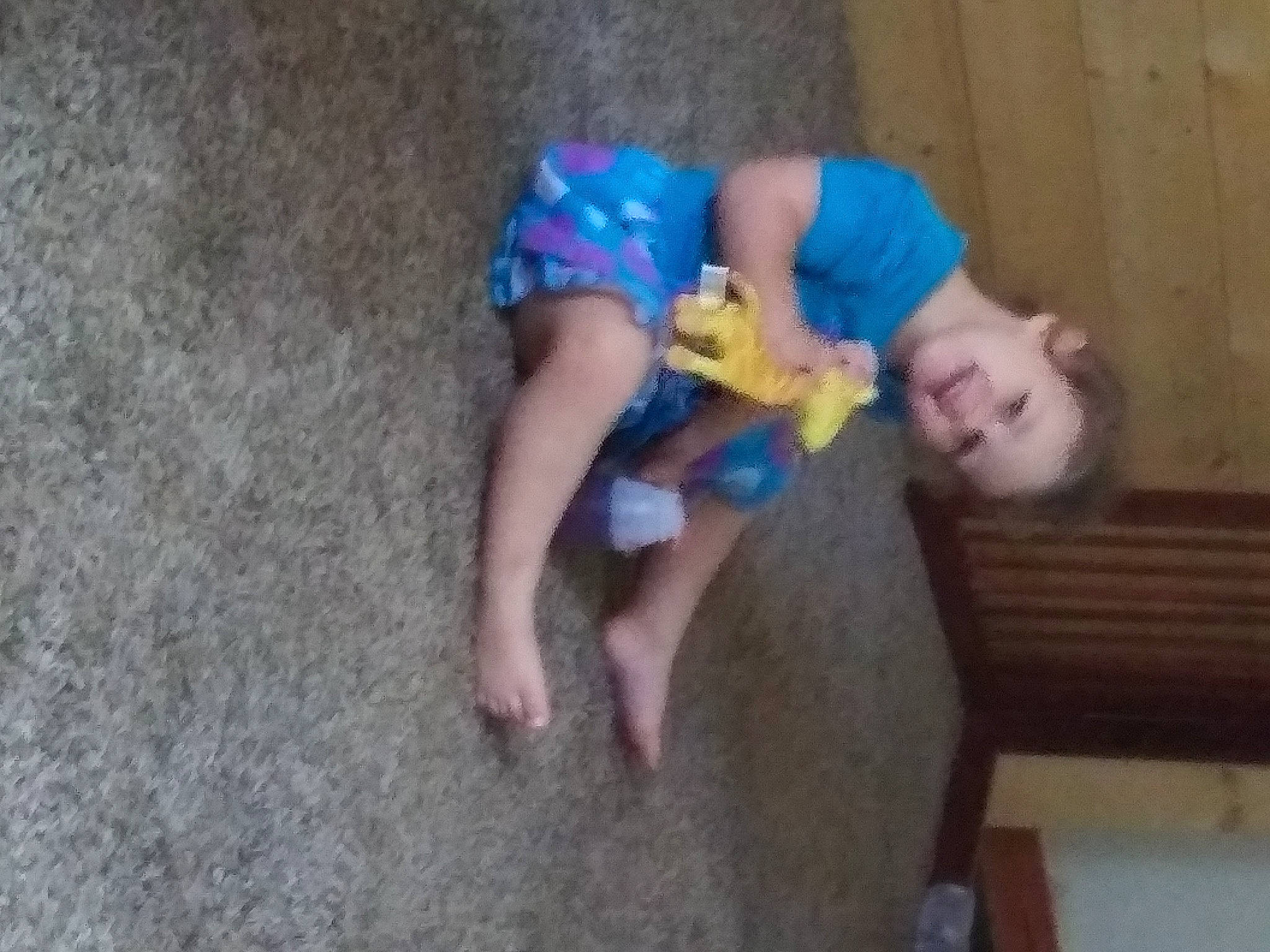 Jazzlyn is registered to the contest to win money with this photo: baby, baby_products, baby_toddler_clothing, child, electric_blue, flooring, foot, fun, hardwood, human_leg, joy, leisure, person, play, room, sitting, thigh, toddler, wood