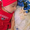 Amyra joined the competition — help win amazing prizes! baby, sleeping, red_headband, red_outfit, flowers, blue_flowers, seashells, starfish, lace, fabric, closeup, portrait, infant, peaceful, resting, cute, soft_lighting, decor, indoor, child