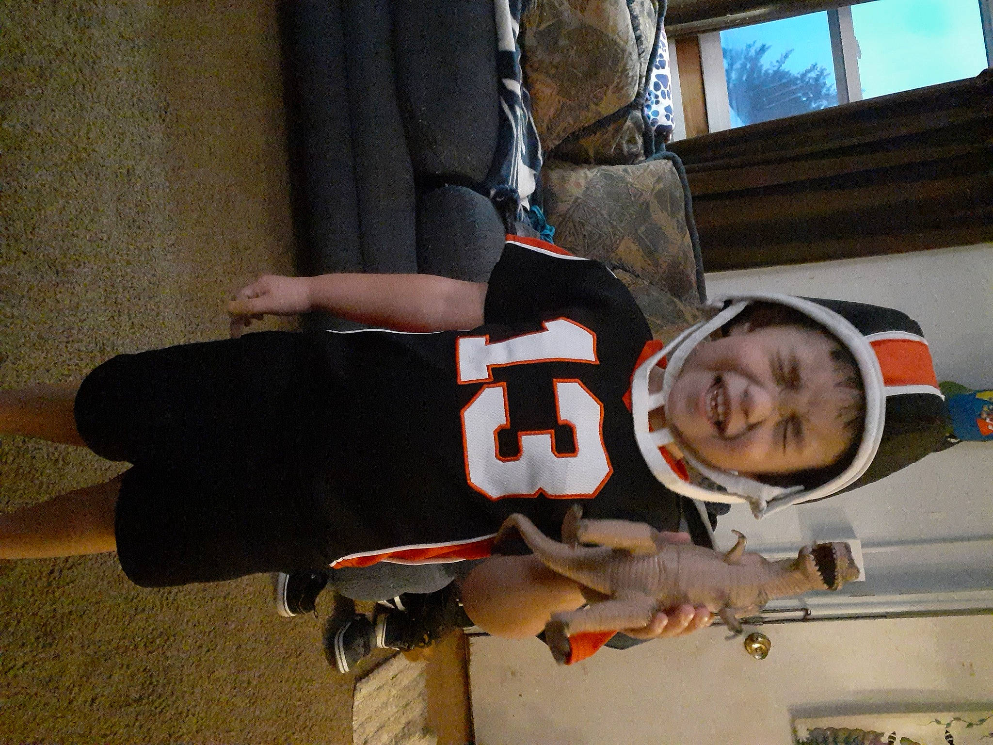 Colton joined the competition — help win amazing prizes! carmine, fun, helmet, human_leg, person, personal_protective_equipment, toddler, tree, uniform, window