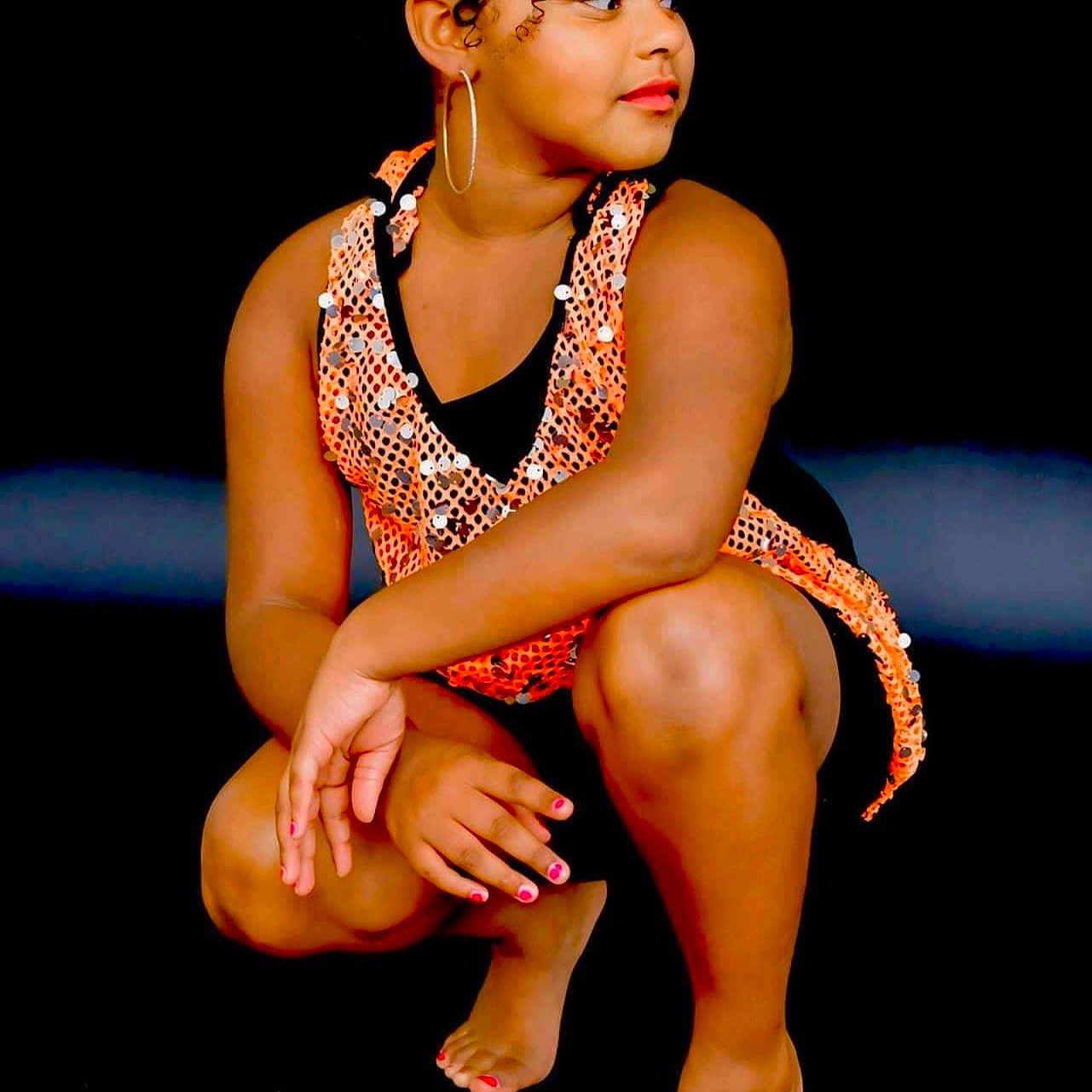 Qwien is registered to the contest to win money with this photo: accessories, adult, ankle, bodypart, clothing, earring, face, female, finger, hand, head, performer, person, photography, portrait, sitting, skin, soloperformance, swimwear, woman