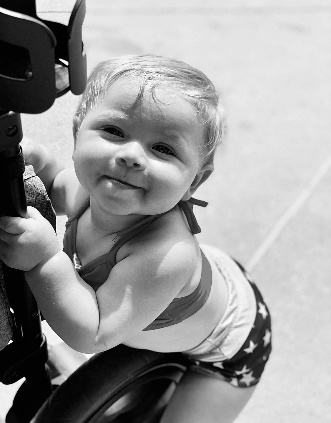 Sawyer is registered to the contest to win money with this photo: baby, baby_products, black_and_white, chest, child, cool, eye, flash_photography, gesture, hairstyle, happy, head, human, joy, monochrome, monochrome_photography, person, personal_protective_equipment, shoulder, smile