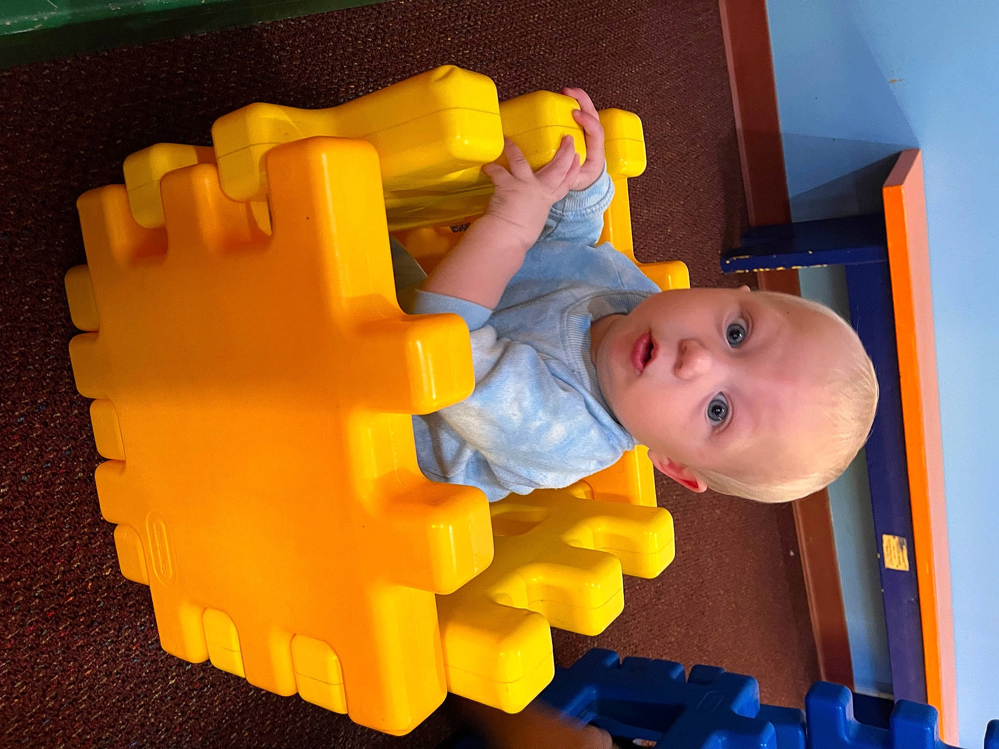 Evander is registered to the contest to win money with this photo: baby, baby_products, baby_toddler_clothing, baby_toys, child, construction_set_toy, finger, fun, gesture, interlocking_block, orange, person, plastic, plastic_arts, play, room, surprise, thumb, toddler, toy