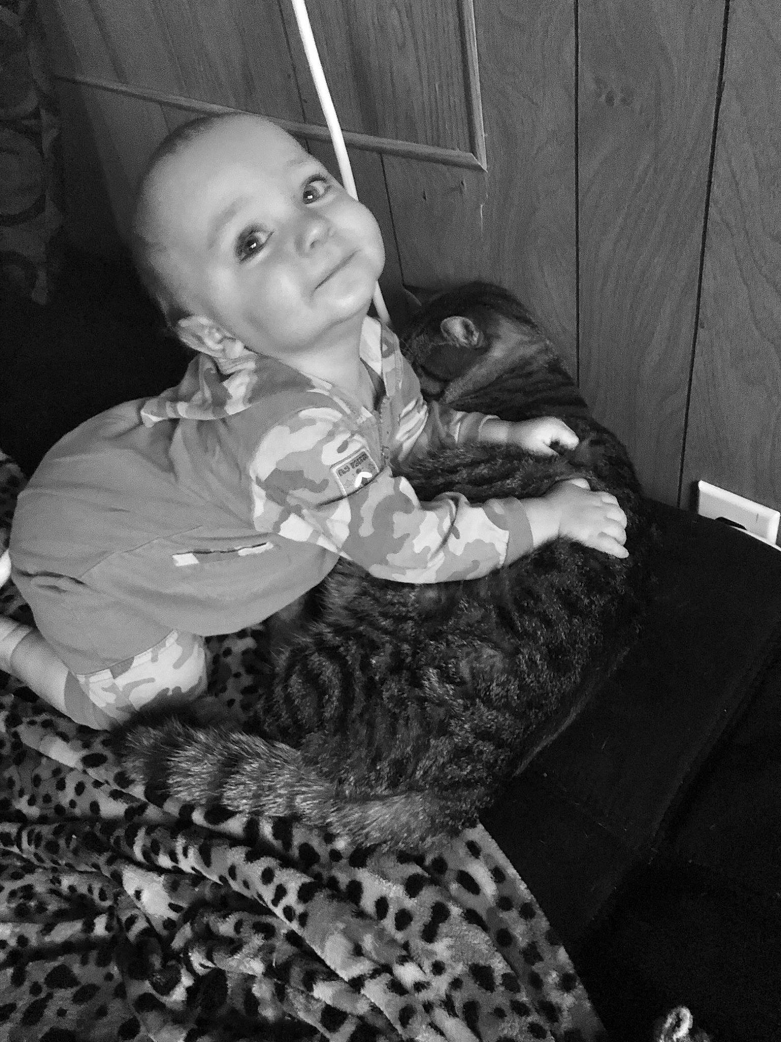 Noah James is registered to the contest to win money with this photo: black, black_and_white, child, emotion, eye, face, girl, head, human, mammal, monochrome_photography, person, photograph, sitting, skin, smile, snapshot, toddler, vertebrate, white