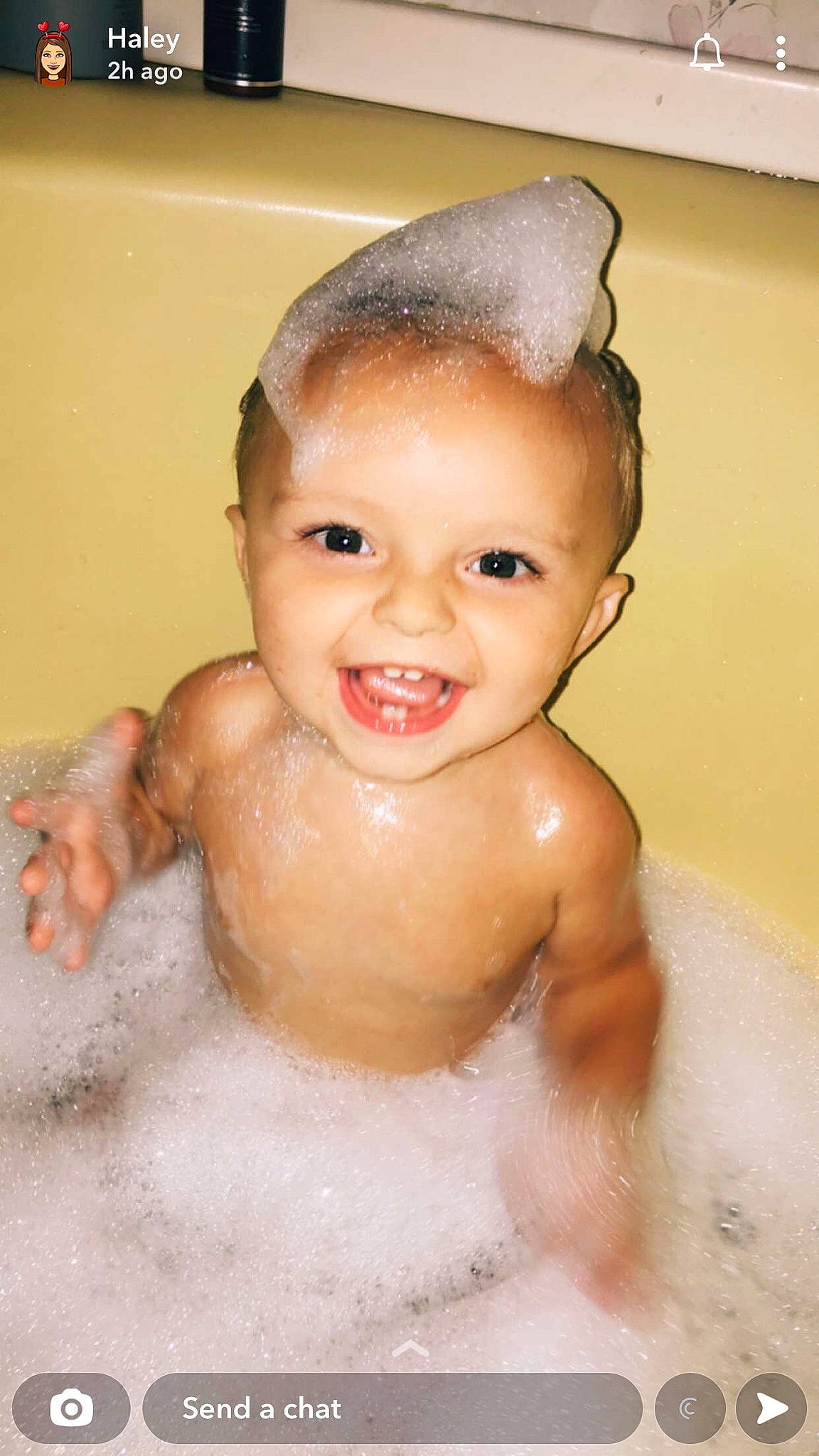 Colson is registered to the contest to win money with this photo: arm, baby_bathing, bathing, bathroom, bathtub, cheek, chest, ear, fluid, foam, human_body, jaw, joy, lip, liquid, nose, organ, person, skin, smile