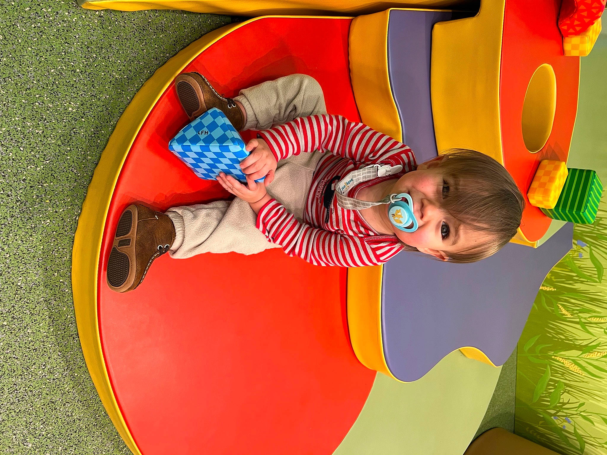 John joined the competition — help win amazing prizes! baby, child, circle, comfort, fun, happy, hat, leisure, linens, outdoor_play_equipment, pattern, person, play, playground, recreation, room, sitting, sunglasses, t_shirt, toddler