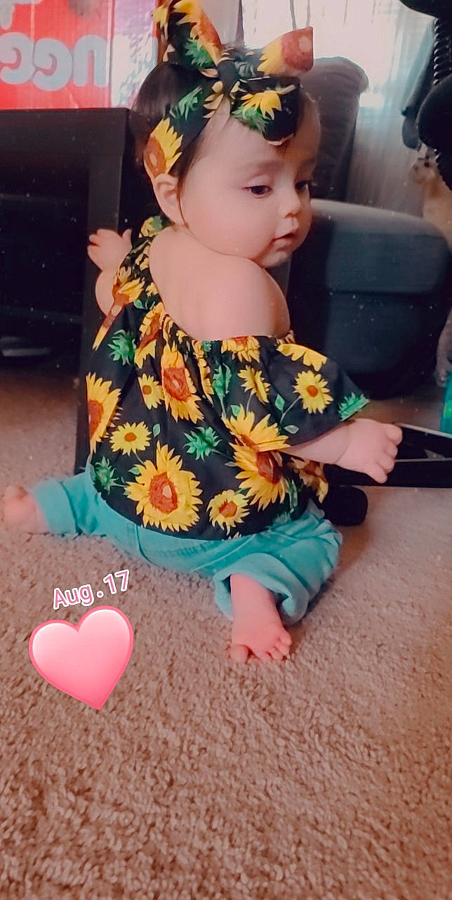 Valencia joined the competition — help win amazing prizes! baby, child, child_model, clothing, ear, fashion_accessory, hair_accessory, headband, headgear, headwear, neck, outerwear, pattern, person, pink, play, sleeve, textile, toddler