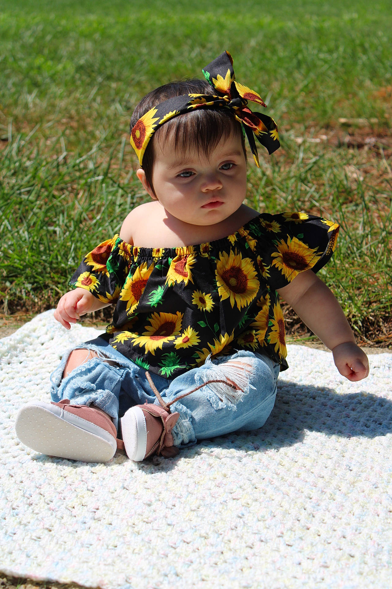 Valencia is registered to the contest to win money with this photo: child, costume, fawn, grass, person, plant, play, sitting, smile, toddler