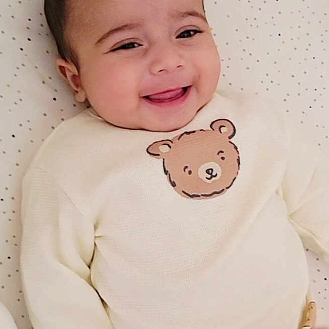 Yanis participe au concours pour gagner de l'argent avec cette photo : baby, bear_design, blanket, child, clothing, cozy, cute, dotted_pattern, face, happy, indoor, infant, lying_down, person, portrait, sleepwear, smiling, soft, sweater, young