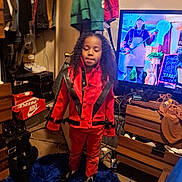 Royall joined the competition — help win amazing prizes! blue_rug, carpet, casual, child, clothes, clothing, curly_hair, door, dresser, furniture, hanger, indoor, person, red_jacket, room_interior, screen, shoes, standing, television, young