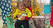 Royall joined the competition — help win amazing prizes! carpet, celebration, child, children, christmas_tree, decorations, family, festive, gift_wrap, happy, holiday, holiday_lights, home, indoors, presents, red_boots, smiling, sweater, togetherness, yellow_slippers
